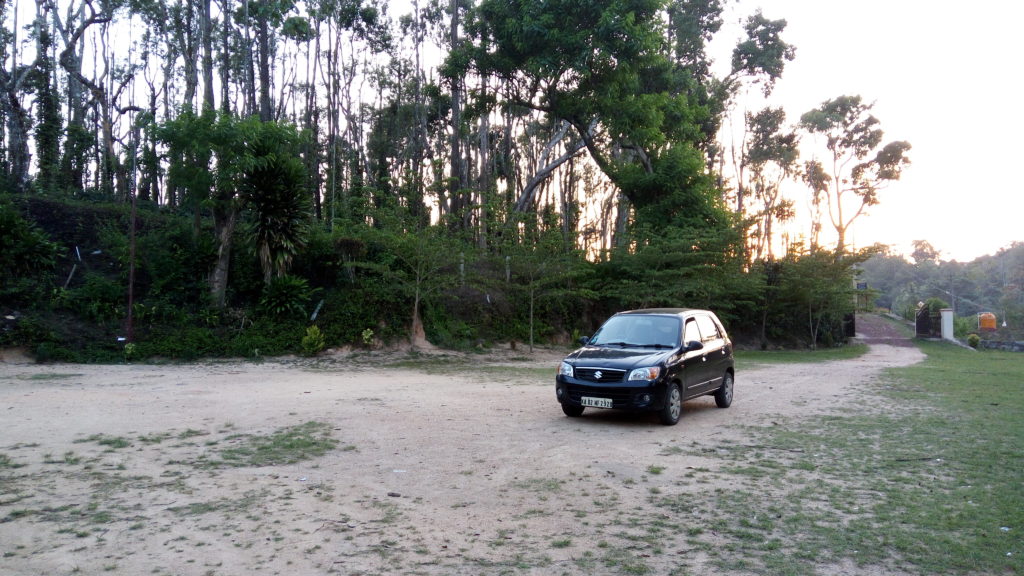 Black Maruti Suzuki Alto K10, trees in the background